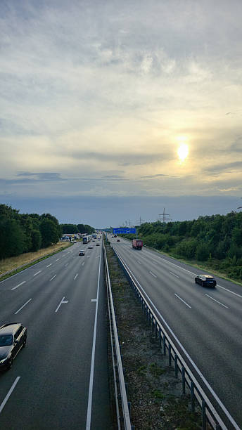 istock A breathtaking scenic view showcasing a highway beneath a stunningly cloudy sunset sky, Hannover Langenhagen 2223781321