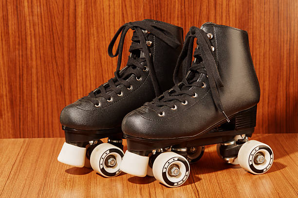 Retro quad roller skate on a wooden background. Vintage pop art