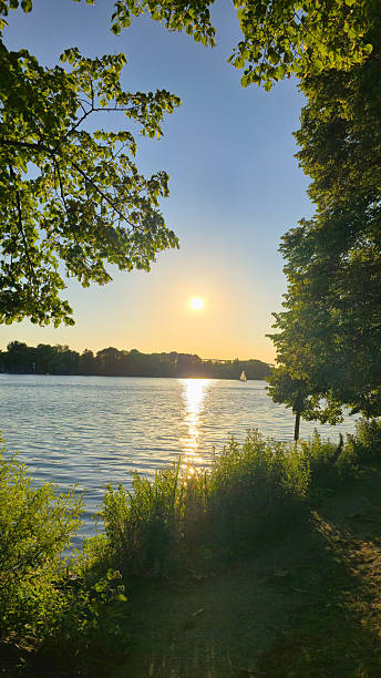 istock A Serene Sunset Over a Tranquil Lake, Beautifully Surrounded by Lush Greenery and Nature Hannover Maschsee 2223782751