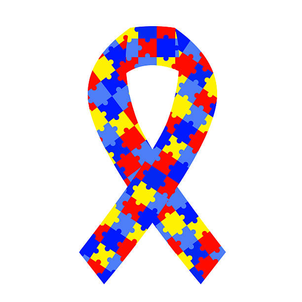 istock Autism awareness ribbon with a colorful puzzle piece pattern in blue, red, and yellow. Vector symbol of the autism and neurodiversity cause for support and inclusion campaigns, 2223783774
