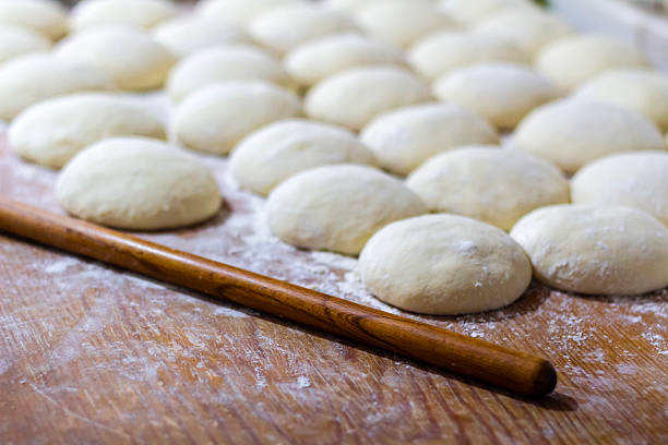 istock Homemade dough on wooden table at home. 2223784828