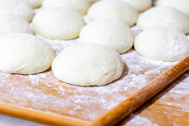 istock Homemade dough on wooden table at home. 2223784865