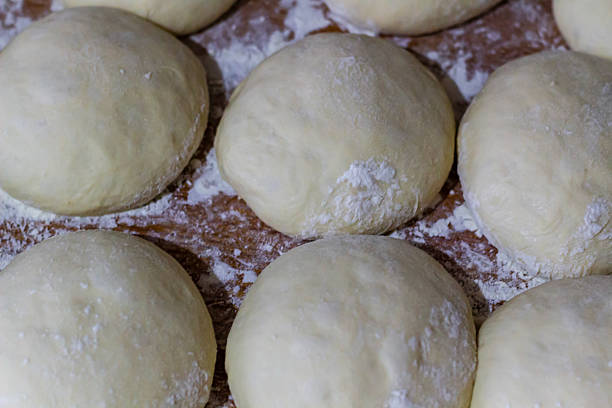 istock Homemade dough on wooden table at home. 2223784891