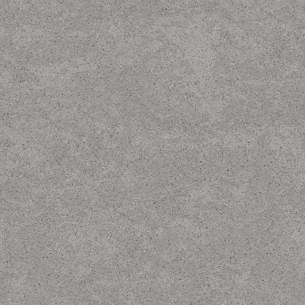 istock A close-up view of a rough gray concrete surface features an irregular texture with scattered fine particles. 2223787101