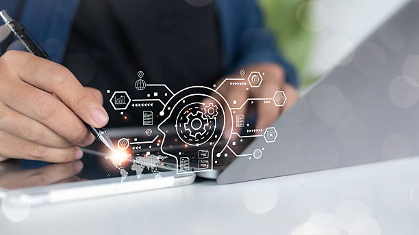 istock Close-up of a hand using a digital tablet and stylus with artificial intelligence, automation process, and business innovation icons, representing AI technology and digital transformation. 2223789002