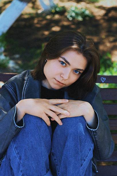 istock Girl in the park on a bench. Retro 2223794200