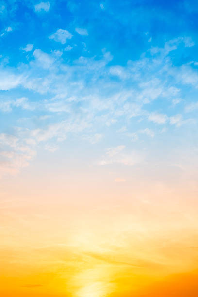 istock Sky,Beautiful sunset view, luxury soft gradient orange gold clouds and sunlight on the blue dramatic sky perfect for the background, morning, evening,Twilight, climate change,Vertical sunset photo 2223797227