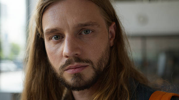 istock Caucasian pensive student guy man male thinking thoughtful look away serious face expression looking at camera in college university portrait problem trouble stress thoughtful headshot study education 2223798095