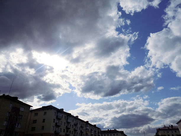 Sun covered by black clouds blue sky nature wallpaper. High quality photo