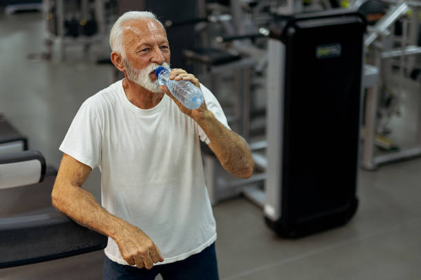 istock Elderly Male Athlete Drinking Water After Cardio 2223799869