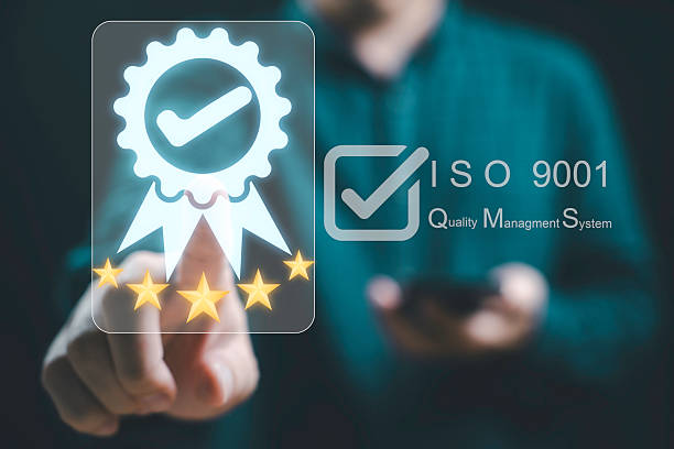 istock Businessman is interacting with a digital display showcasing ISO 9001 certification and a quality management system for emphasizing a commitment to excellence and quality assurance concept. 2223801988