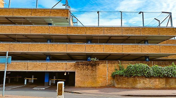 istock Urban facade texture with brick parking layers and blue sky as abstract background 2223805079