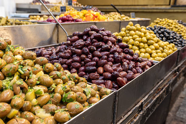Fresh Olives Display at Market Showcasing Various Types and Colors