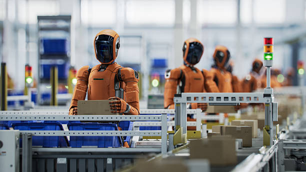 istock 3D Render: Orange Autonomous AI-Enabled Humanoid Robot Working at Fulfillment Center. He is Sorting Packages and Moving Boxes. Automated Warehouse or Logistics Center with General Purpose Robots 2223812877