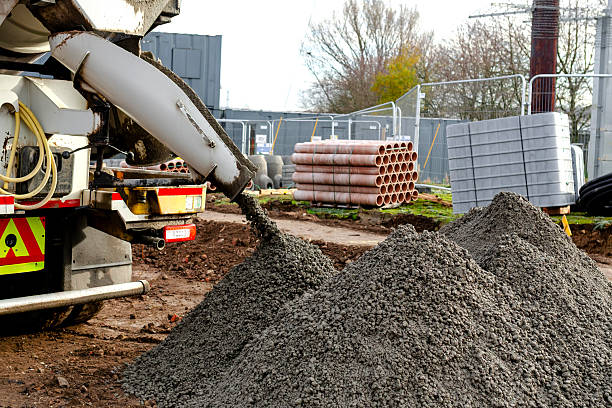 istock Semy-dry ready mix concrete delivered on construction site and unloaded into pile on ground 2223814132