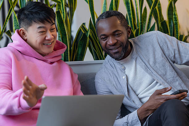 istock Multiethnic business partners collaborating on laptop in informal workspace 2223814780