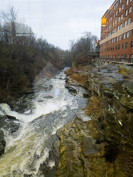 istock Cuyahoga River flows alongside historic building on a cloudy day 2223817139