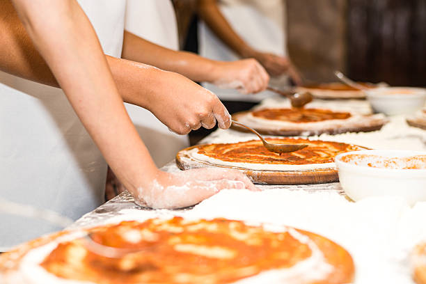 Children's hands are making delicious pizza