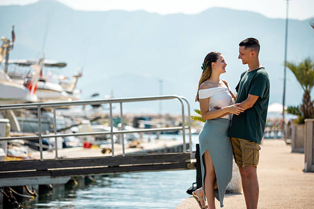 istock Young Couple Holding Each Other by Marina Deck on Summer Vacation 2223820010