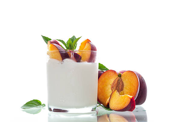 istock Homemade yogurt and bright ripe nectarines in studio shooting without background 2223821949
