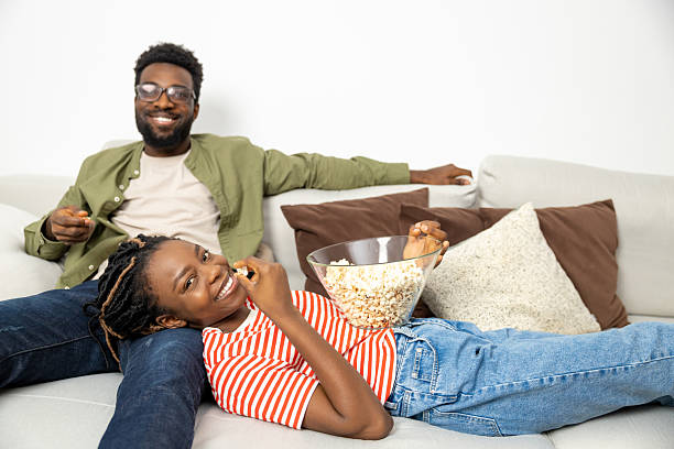 istock Cute young couple spending time at home on a weekend and looking happy 2223822725