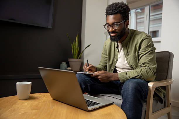 istock African american young man working on a laptop 2223822780