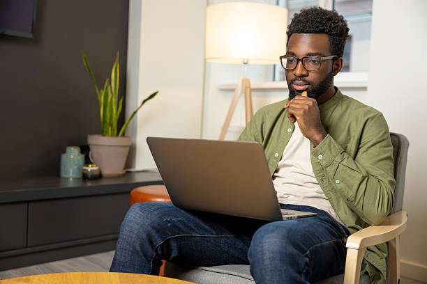 istock Young dark-skinned man in eyeglasses working and looking thoughtful 2223822813