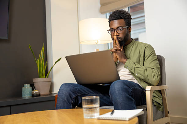 istock Young dark-skinned man in eyeglasses working and looking thoughtful 2223822821