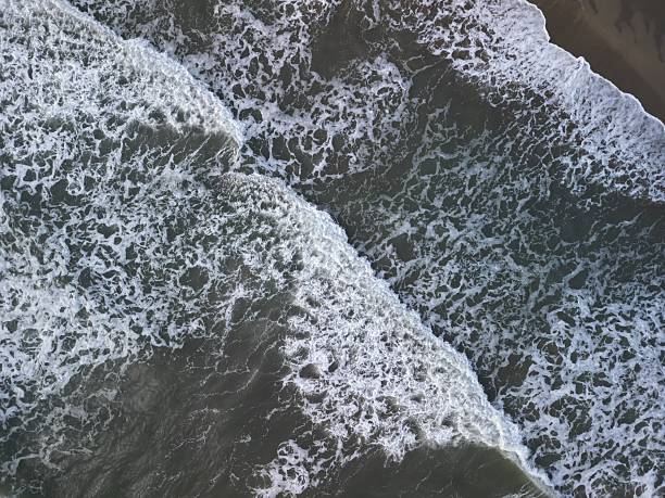 istock rough sea that washes the beach 2223825030