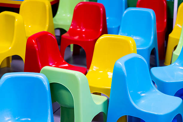 colored plastic chairs used in playrooms during children's parties