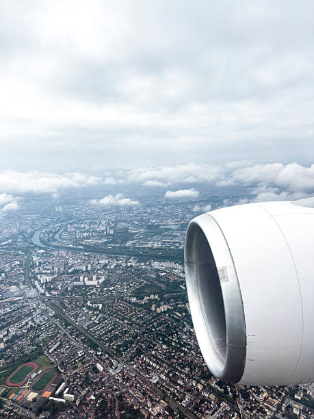 istock Airplane flying above the clouds 2223825950