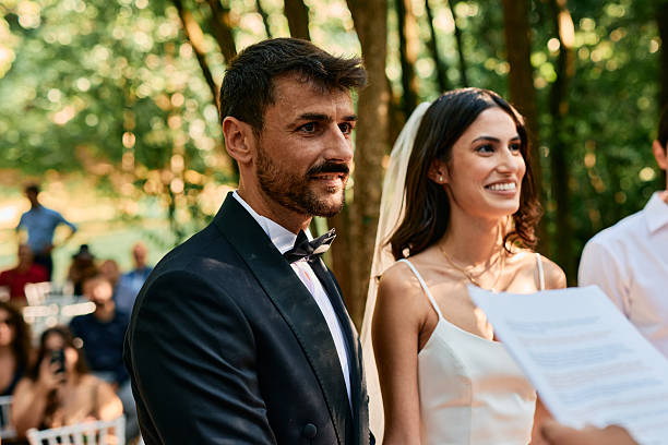 istock Happy couple getting married during wedding ceremony in the woods 2223831864