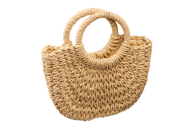 istock A beige straw bag isolated on a white background. 2223832625