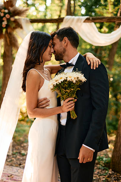 istock Romantic couple celebrating their wedding in a forest 2223832841