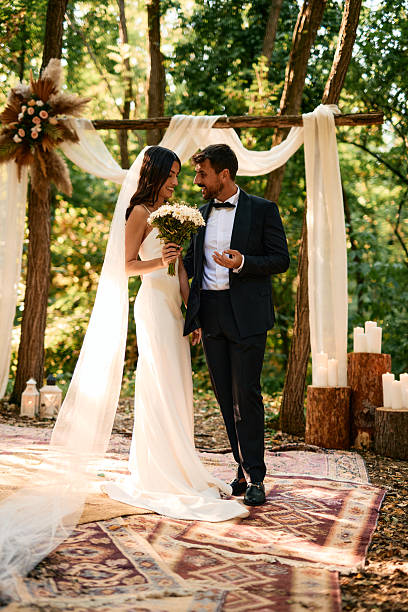 istock Bride and groom exchanging vows during a forest wedding ceremony 2223832952