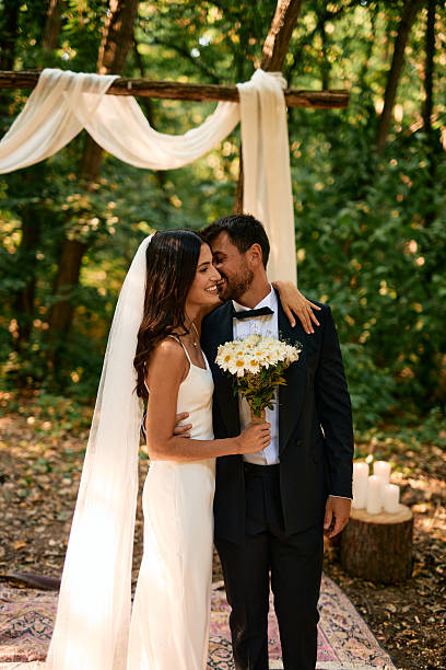 istock Romantic couple getting married in a forest ceremony 2223833053