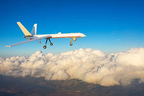 istock Combat drone flies high in the sky sunset clouds. Modern warfare and drones spy. 2223836984