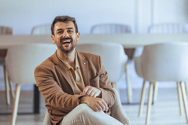istock Confident Young Businessman Smiling in Modern Office Setting 2223837770