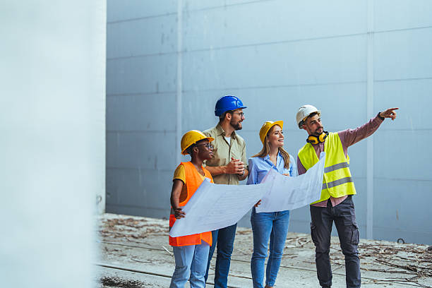 istock Team of architects and civil engineers inspecting construction site. 2223838373