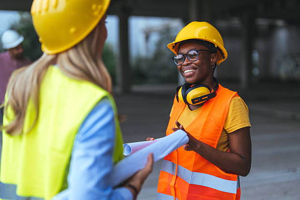 istock Architect caucasian woman working with colleagues mixed race in the construction site. 2223838448