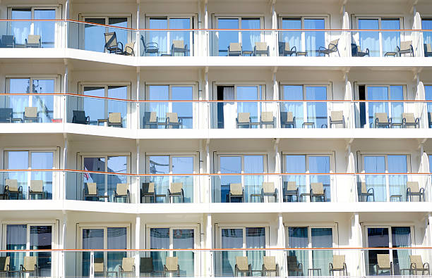 Ketchikan, Alaska -- August 8, 2024: Close up of cruise ship balcony with no people. Relaxing deck chairs are on each balcony.