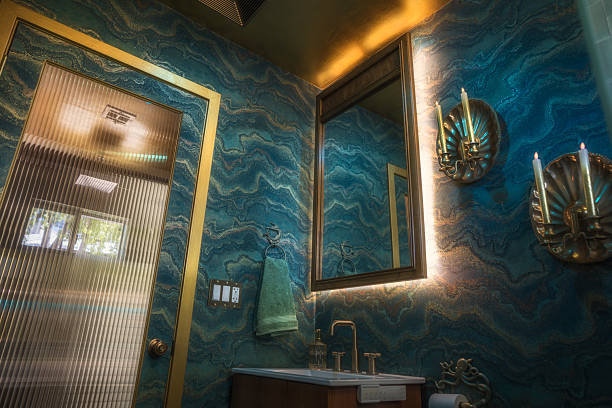 istock Art Deco Ocean Bathroom with Gold Mirror and Wave Walls 2223841621
