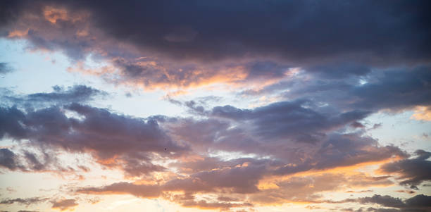 istock Beautiful bright sunset sky background with clouds.  Evening time 2223842038