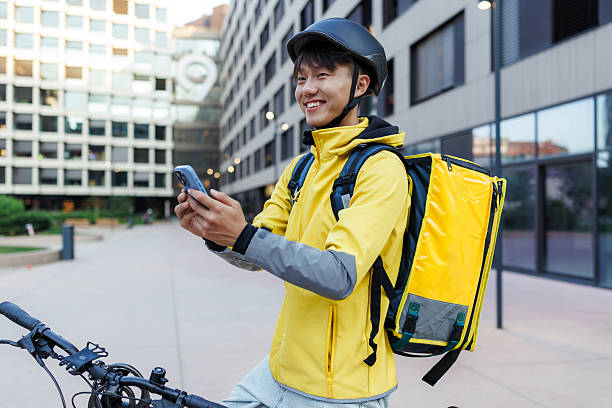 istock Courier on a bicycle using a smart phone for navigation in the city 2223843305