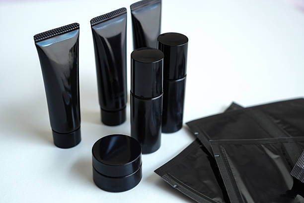 istock Elegant black cosmetic samples on white background 2223844177