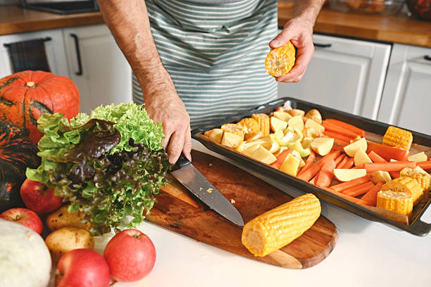 mature adult man prepares festive dinner