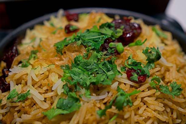 Vegan biryani rice dish garnished with fresh herbs and spices