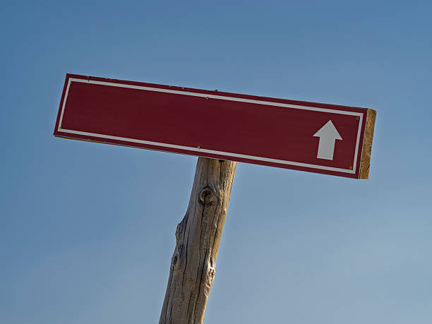 Wooden sign with forward arrow