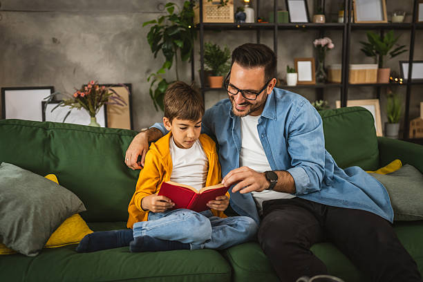 istock Father and son read a book and have fun while spend time together 2223849760