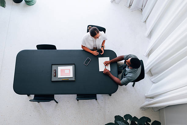 istock Professional Business Meeting Between Two Colleagues in Modern Office Setting 2223853420